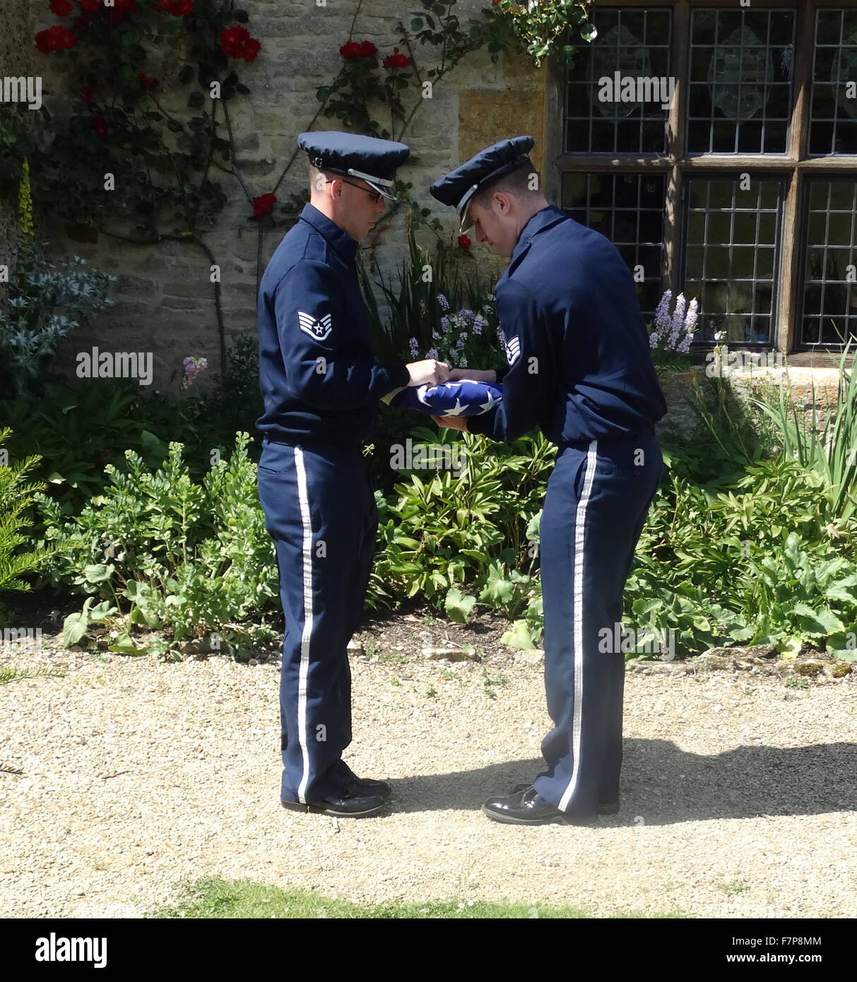 Flag lowering ceremony by US Air force servicemen at Sulgrave Manor, England, ancestral home of George Washington. 2015 Stock Photo
