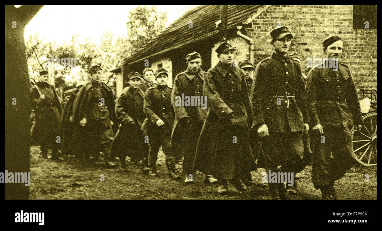 German soldiers are shown taking Polish soldiers captive as prisoners of war. Taken shortly after the German forces invaded Poland in 1939. Stock Photo