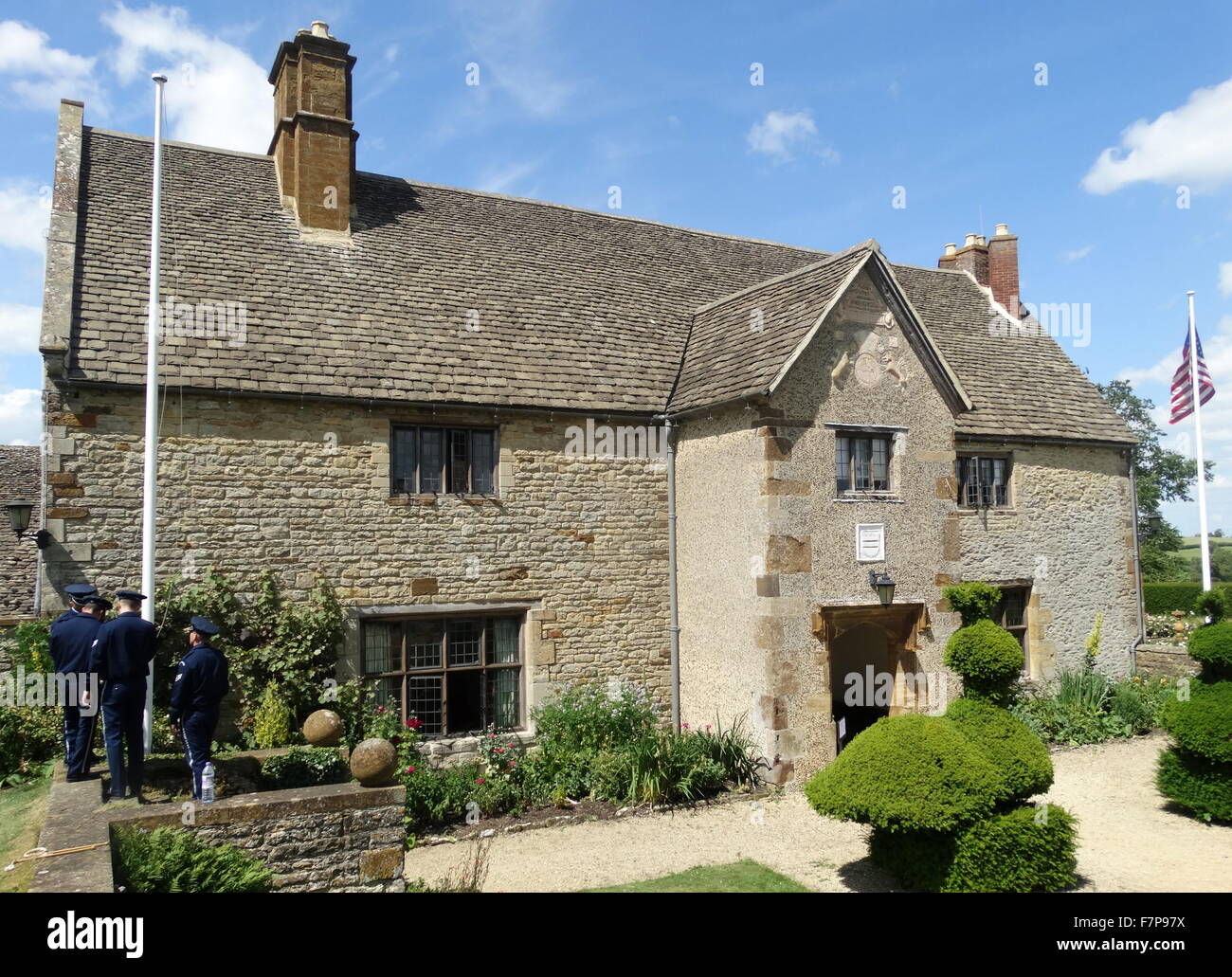 Flag lowering ceremony by US Air force servicemen at Sulgrave Manor, England, ancestral home of George Washington. 2015 Stock Photo