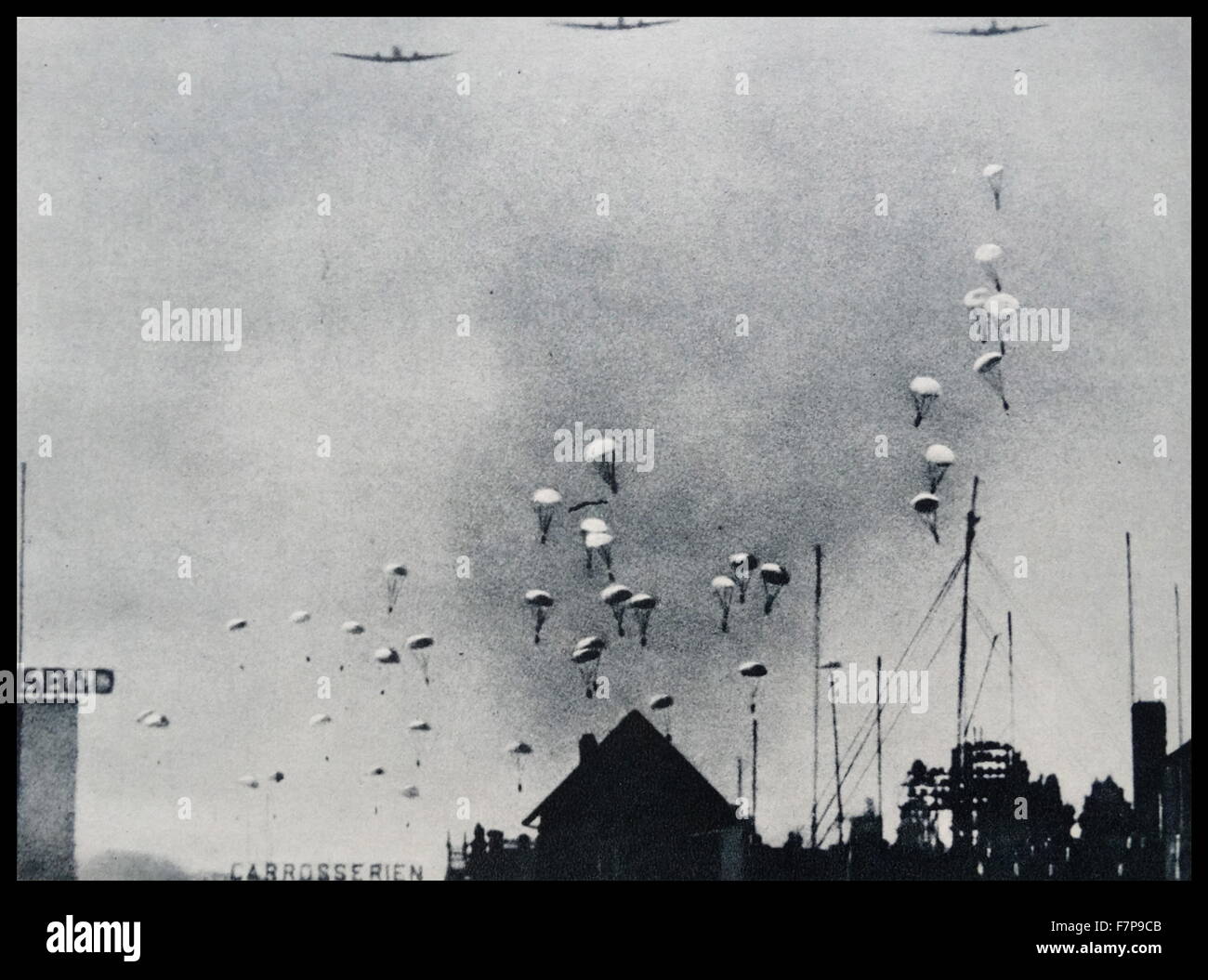 German paratroopers descend in to rotterdam, holland. Taken during the invasion of Holland, by German forces in 1940. Stock Photo