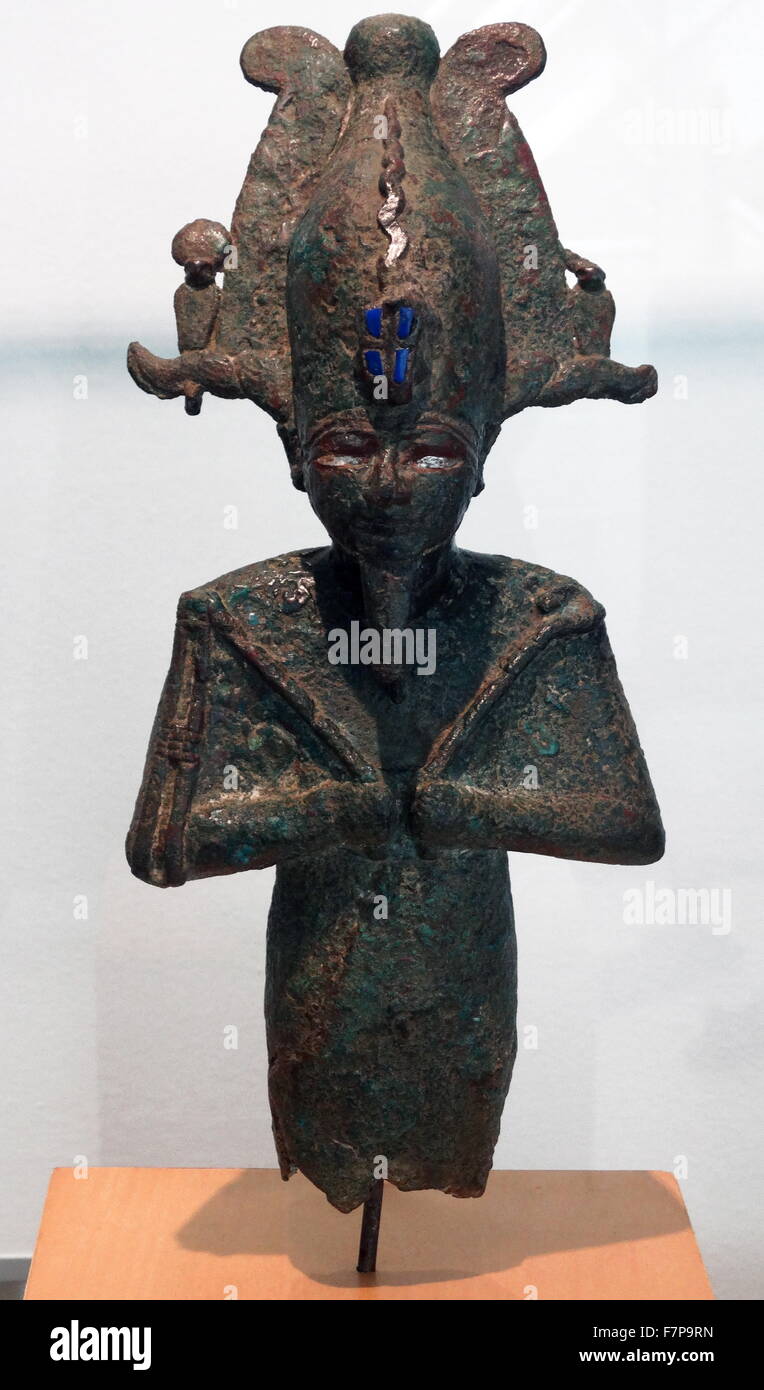 Statuette of the god ancient Egyptian God Osiris. Bronze. Late Period (715-332 BC). In a bloody battle, Seth dismembered Osiris and spread his remains all around Egypt. Isis searched for the fragments to make a mummy and thus bring her beloved husband to life once again Stock Photo