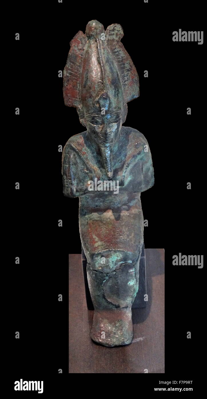 Statuette of the god ancient Egyptian God Osiris. Bronze. Late Period (715-332 BC). In a bloody battle, Seth dismembered Osiris and spread his remains all around Egypt. Isis searched for the fragments to make a mummy and thus bring her beloved husband to life once again Stock Photo