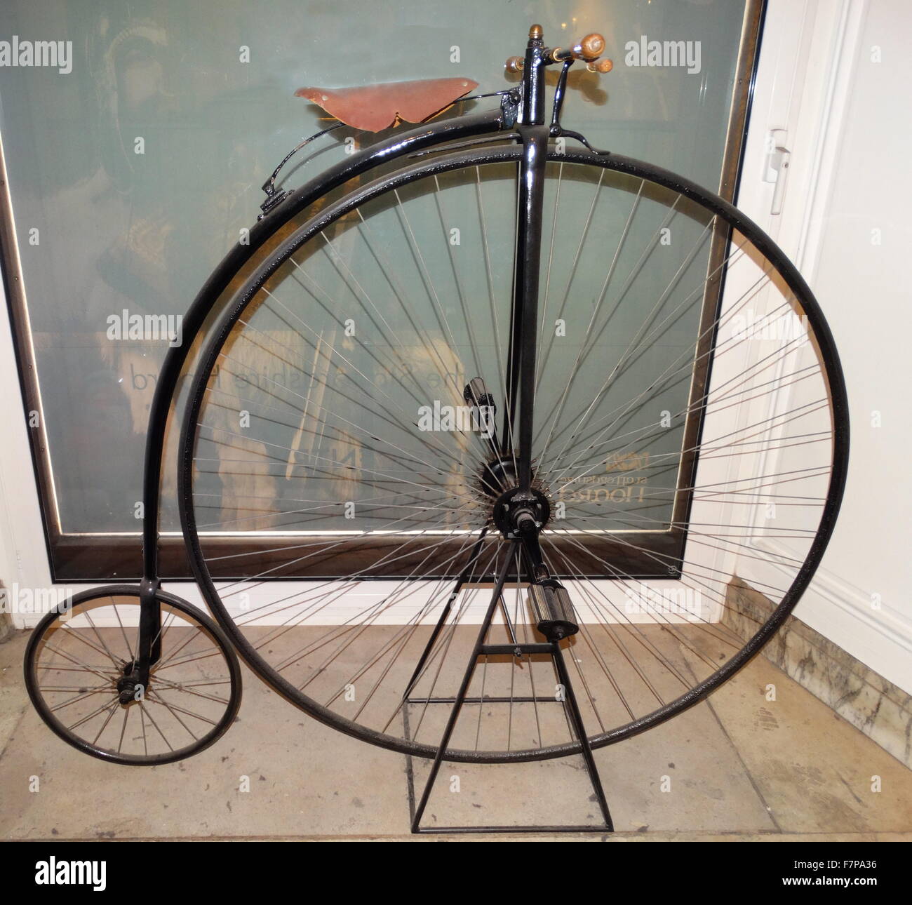The penny-farthing, also known as a high wheel, high wheeler and ordinary, is a type of bicycle with a large front wheel and a much smaller rear wheel. It was popular after the boneshaker until the development of the safety bicycle in the 1880s Stock Photo