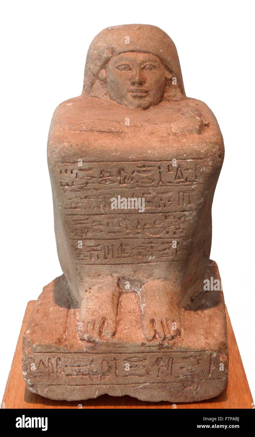 Egyptian block statue of a scribe called Huy. Limestone. 19th Dynasty (13071196 BC Stock Photo