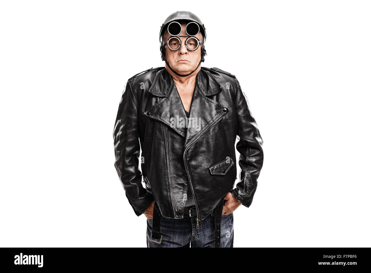Grumpy mature motorcyclist posing in a black leather jacket with a helmet and goggles isolated on white background Stock Photo