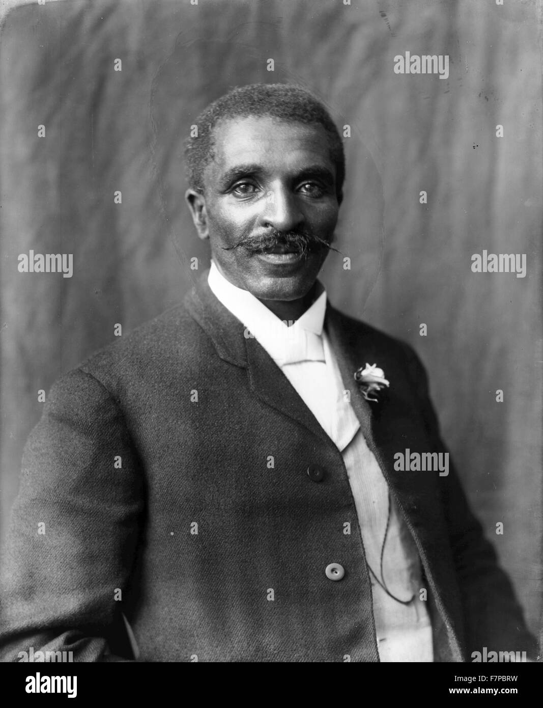 Photographic print of George Washington Carver (born into slavery in 1861or1864 - 1943), half-length portrait, facing right, Tuskegee Institute, Tuskegee, Alabama by Benjamin Frances Johnston, (1864-1952). Stock Photo