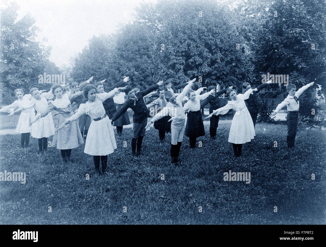 Photographic print, Cyanotype : School children exercising on lawn, Washington, D.C. by photographer Benjamin Frances Johnston. Stock Photo