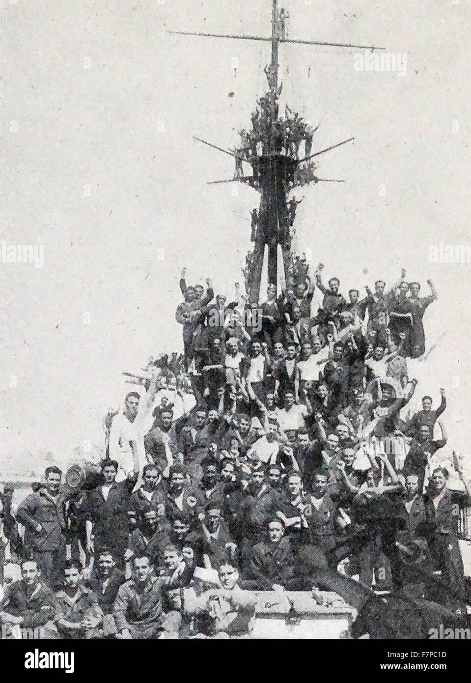 Victorious crew of the Spanish Nationalist Cruiser 'Libertad 1936. In the first months 1936 she took part of a gunnery exercise with live ammunition along with the battleship Jaime I and the Miguel de Cervantes in which they sank the target ship, the old unarmoured cruiser Conde del Venadito Stock Photo