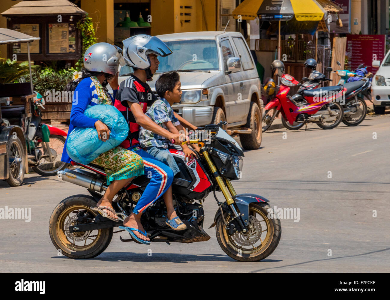 Family on motorcycle. Motorcycles in Siem Reap, Cambodia, Stock Photo