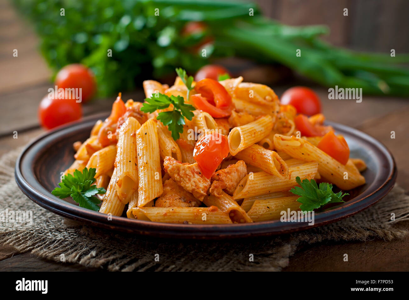 Penne Pasta In Tomato Sauce With Chicken Tomatoes Decorated With Stock Photo Alamy