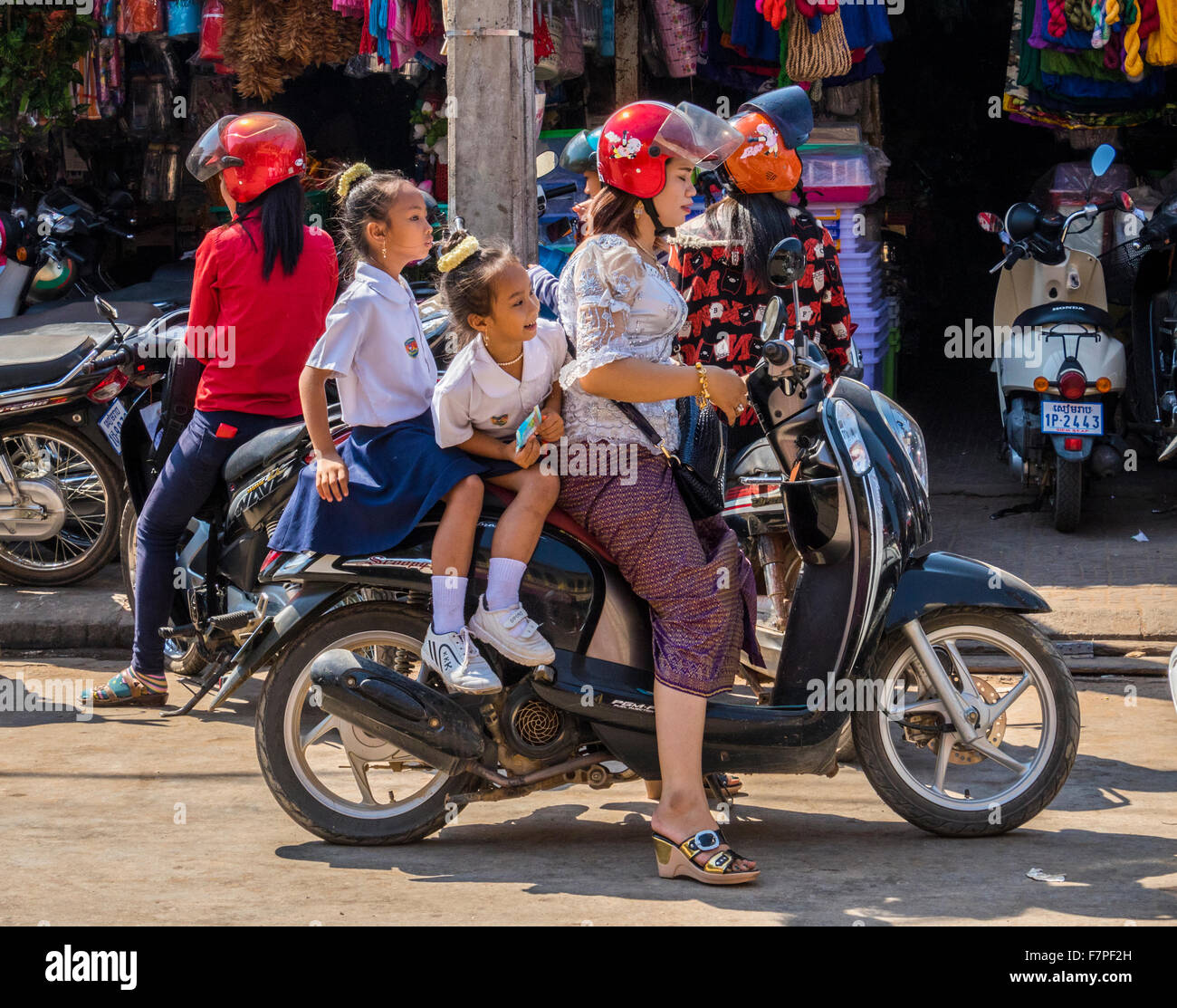 Mother and children on motor cycle in Siem Reap Cambodia Stock Photo