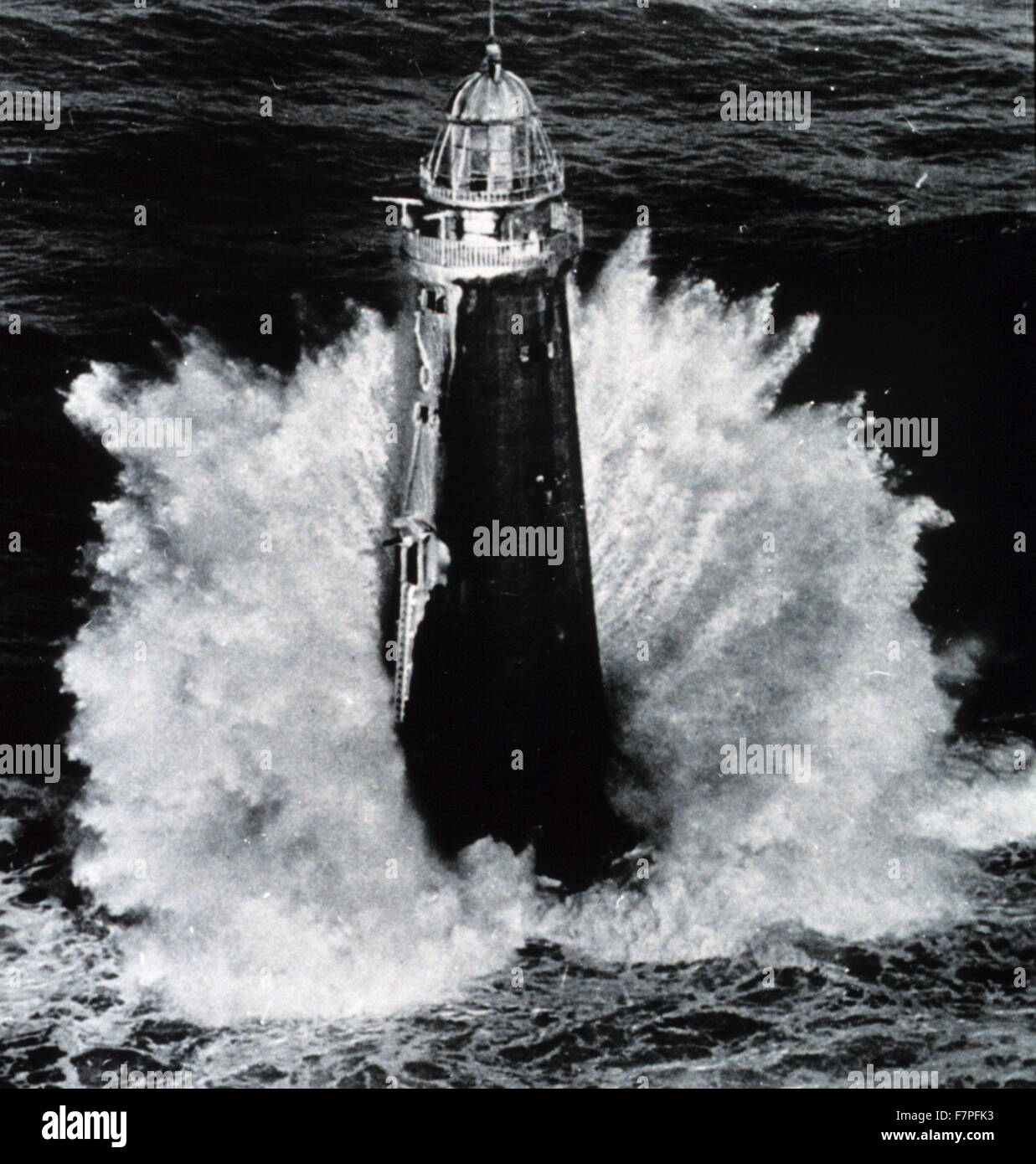 Photograph of rough weather hitting a lighthouse. Dated 1979 Stock Photo