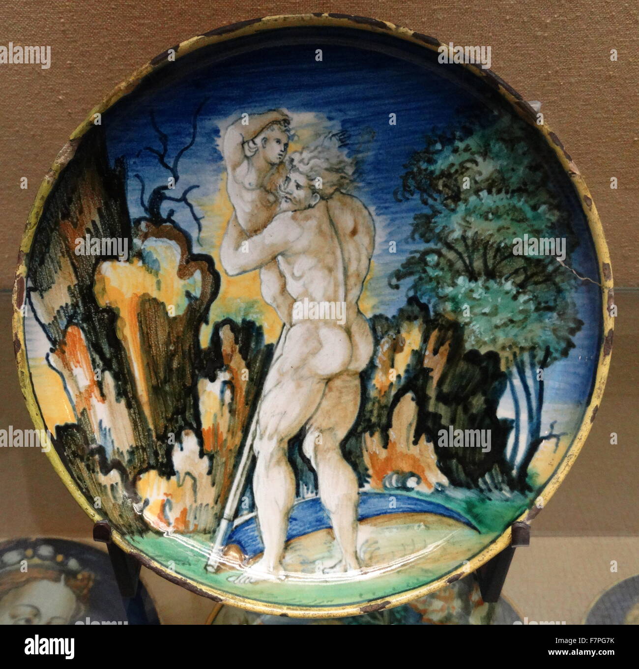 Dish depicting 'Saturn devouring one of his children' by Urbino. Dated 16th Century Stock Photo