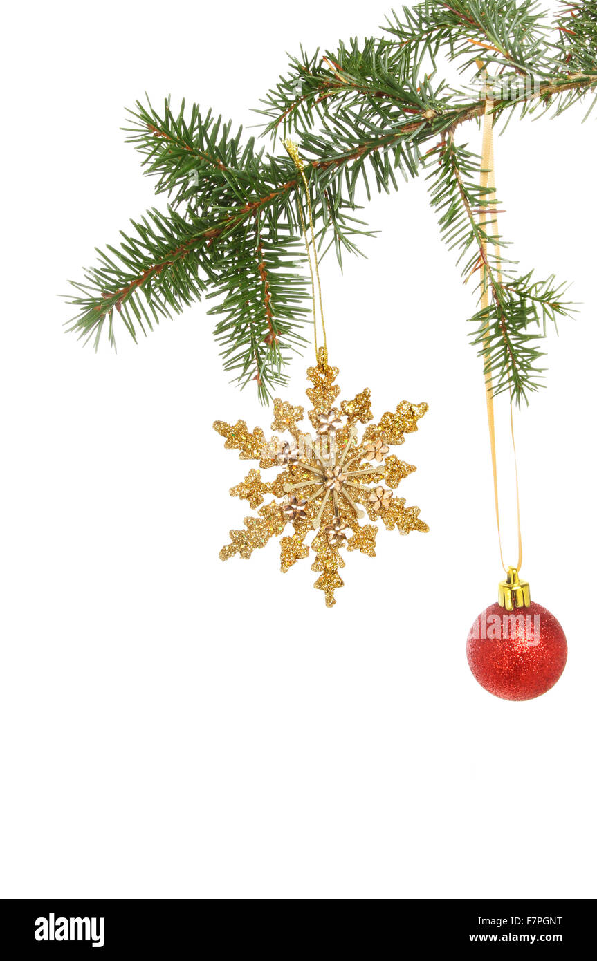 Gold glitter Christmas star ornament and red bauble hanging from a ...