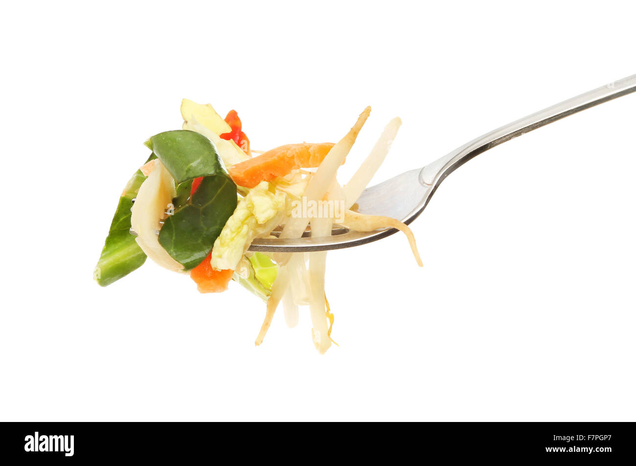 Stir fry vegetables on a fork isolated against white Stock Photo