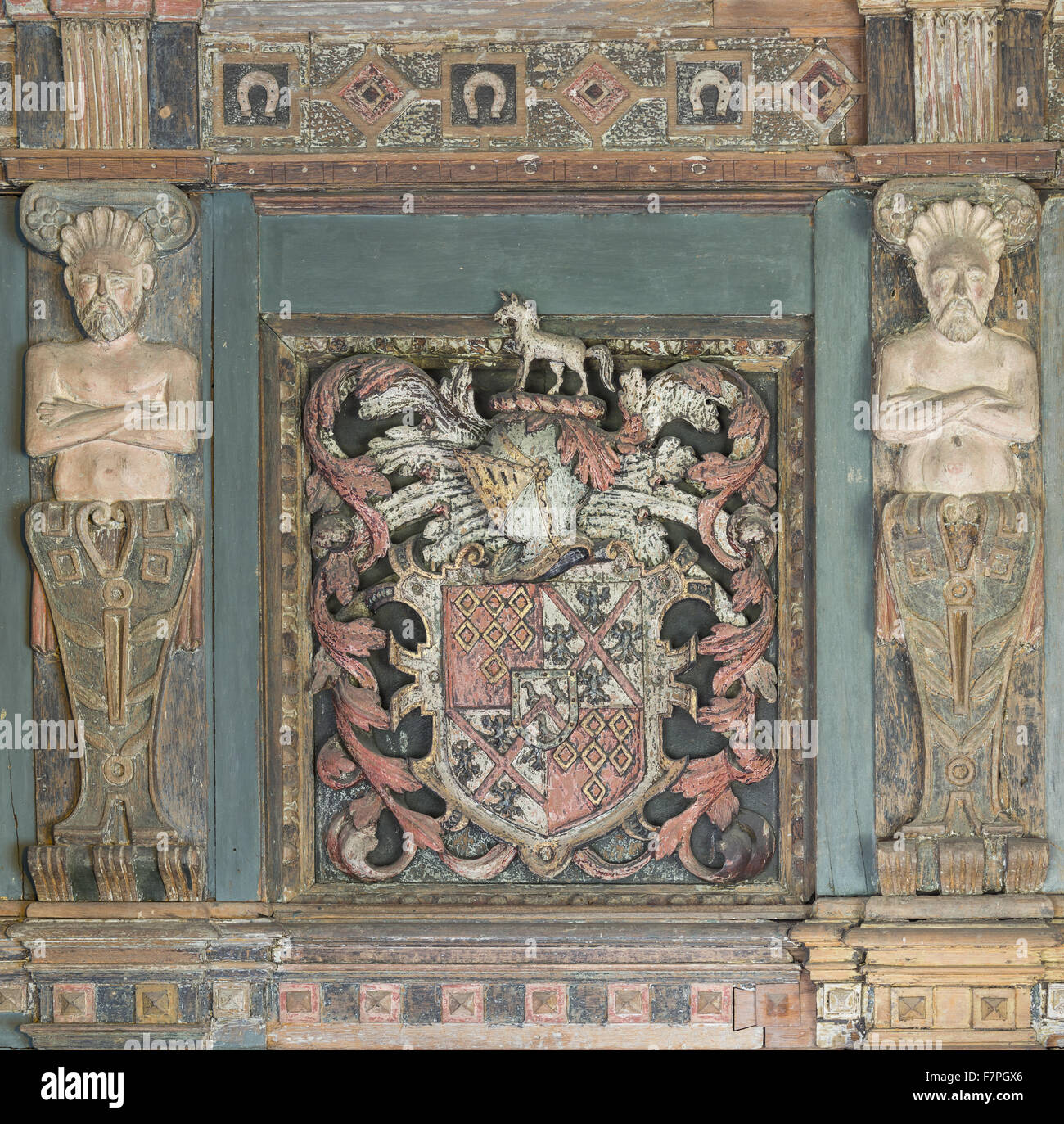 Detail of the elaborate wooden chimneypiece (c.1629) in Henry Ferrer's Bedroom, Baddesley Clinton, Warwickshire. The carving includes the arms of the Ferrers of Groby quartering Hampden (Henry's grandmother's family) and a shield of pretence in the centre Stock Photo