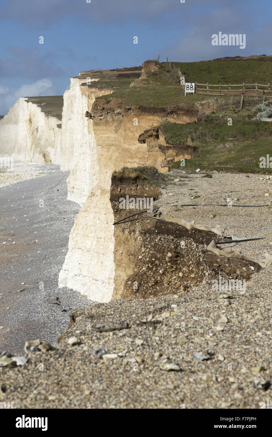 View of the storm-damaged cliffs and beach at Birling Gap, East Sussex, pictured here in February 2014. Extreme weather in January and February of that year resulted in seven years' worth of erosion at Birling Gap in just a few weeks. Stock Photo