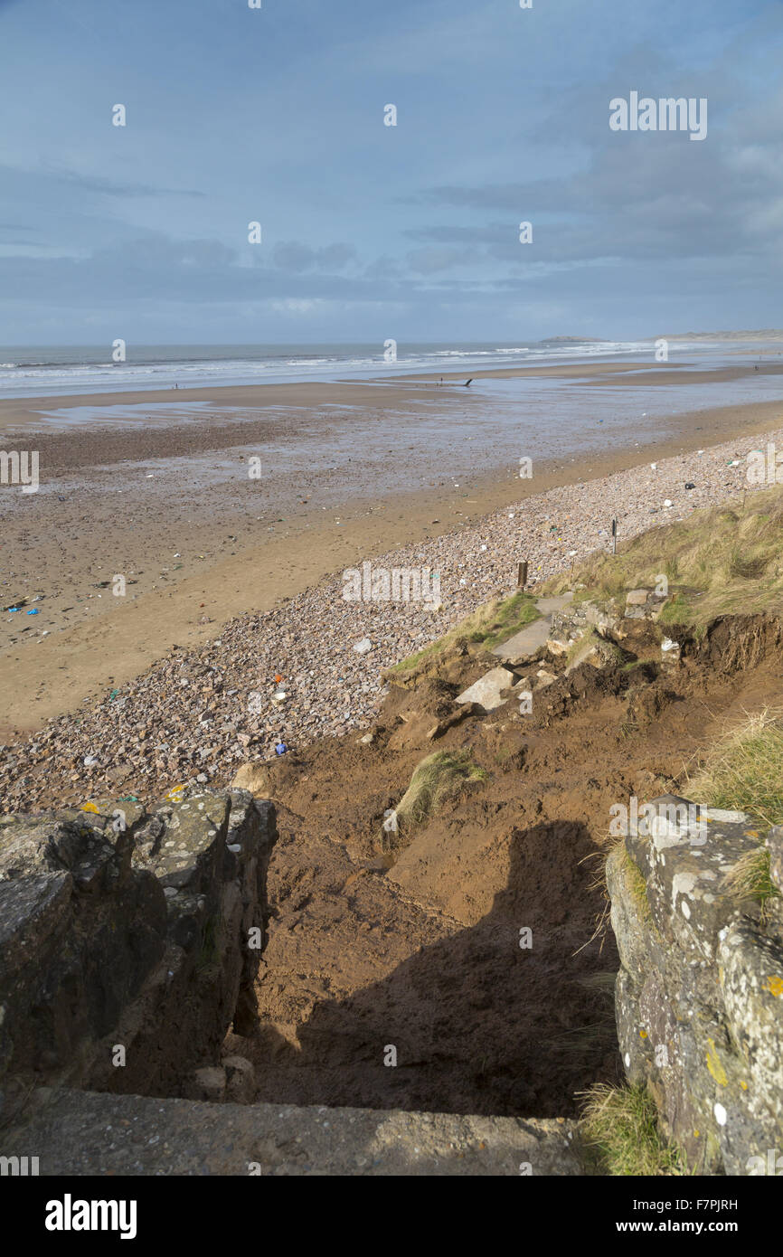 View of the storm-damaged cliffs, steps and beach at Rhossili Bay, Gower, Swansea, Wales, pictured here in February 2014. Part of the cliff face collapsed on 22 January 2014 following erosion caused by powerful storm surges. Stock Photo