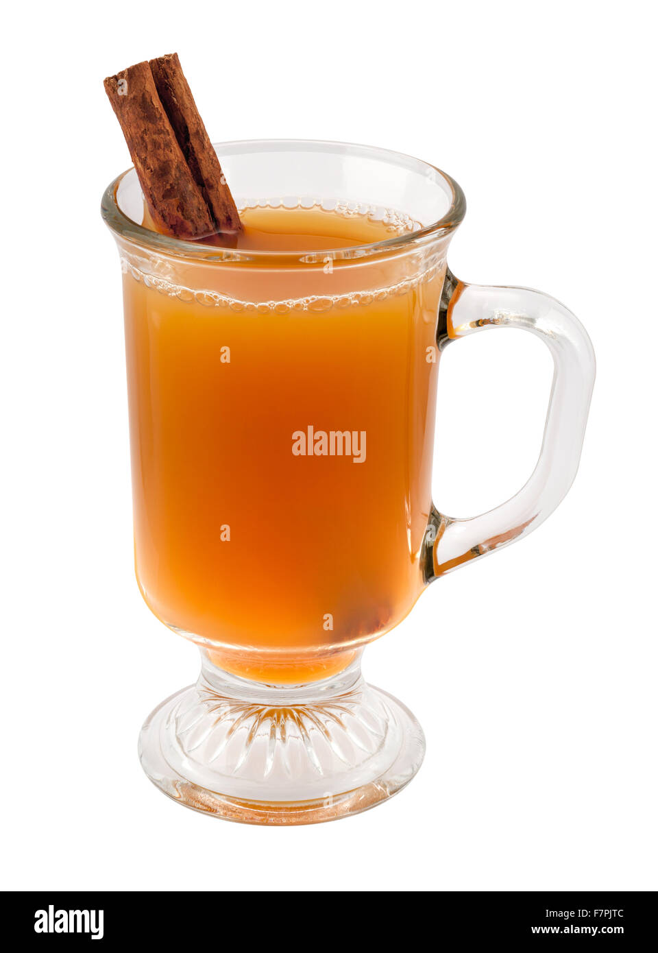 Apple Cider and Cinnamon Stick in a Glass Mug Stock Photo