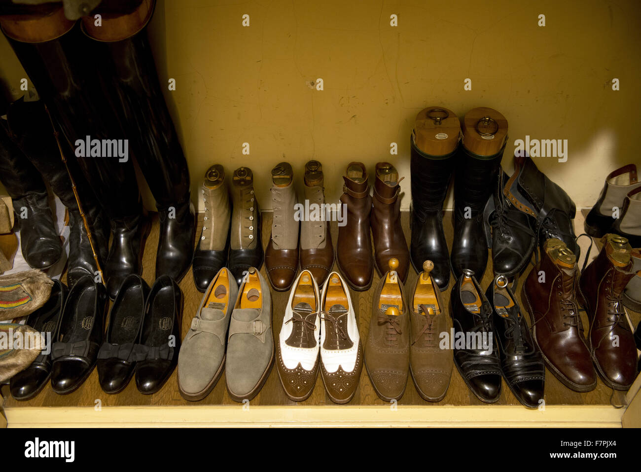 Shoes in a cupboard at Anglesey Abbey, Gardens and Lode Mill, Cambridgeshire. Stock Photo