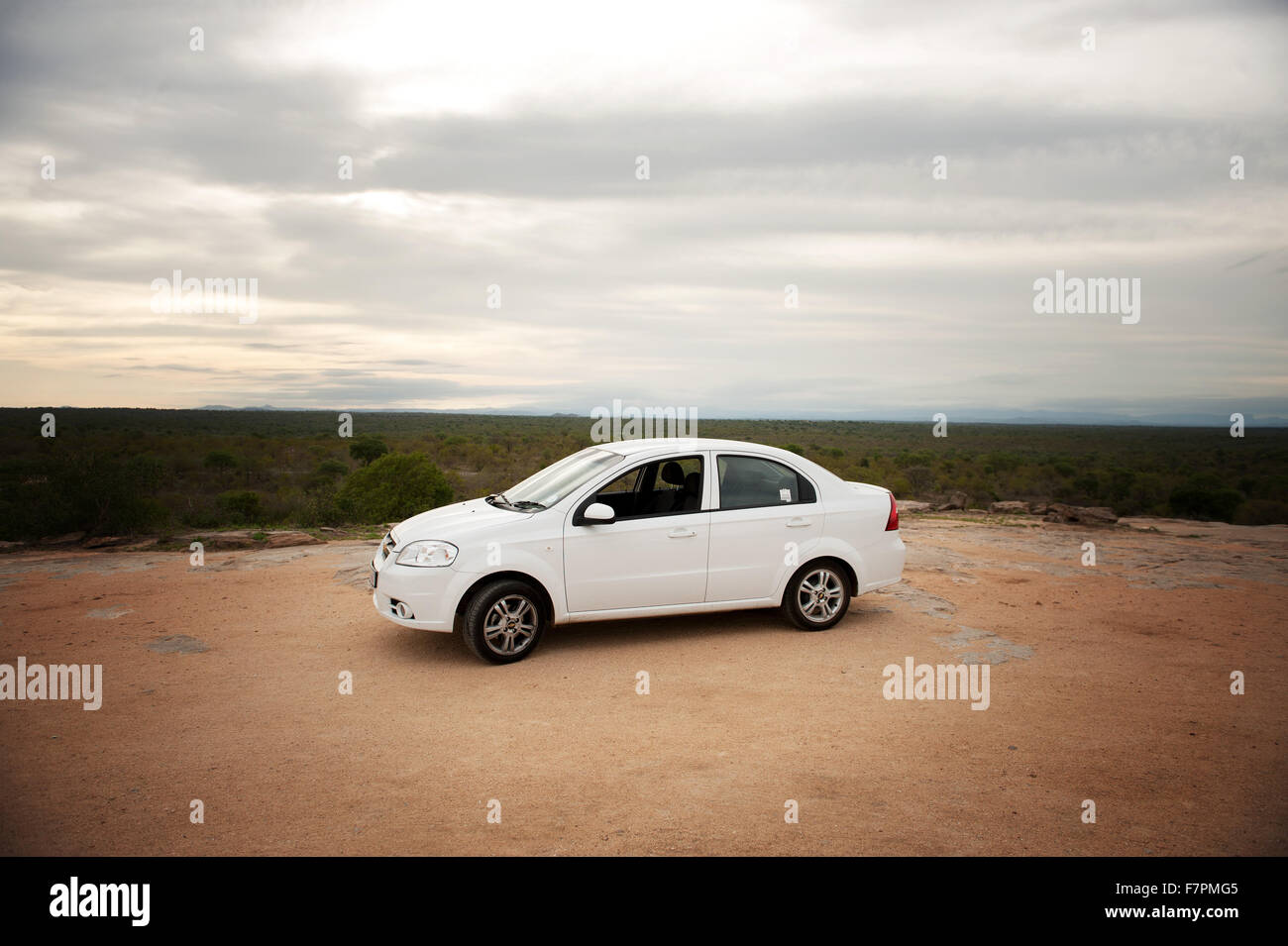 A car parked on the top of the Mathekenyane, a large rock outcrop rising above the first in Kruger National Park, South Africa Stock Photo