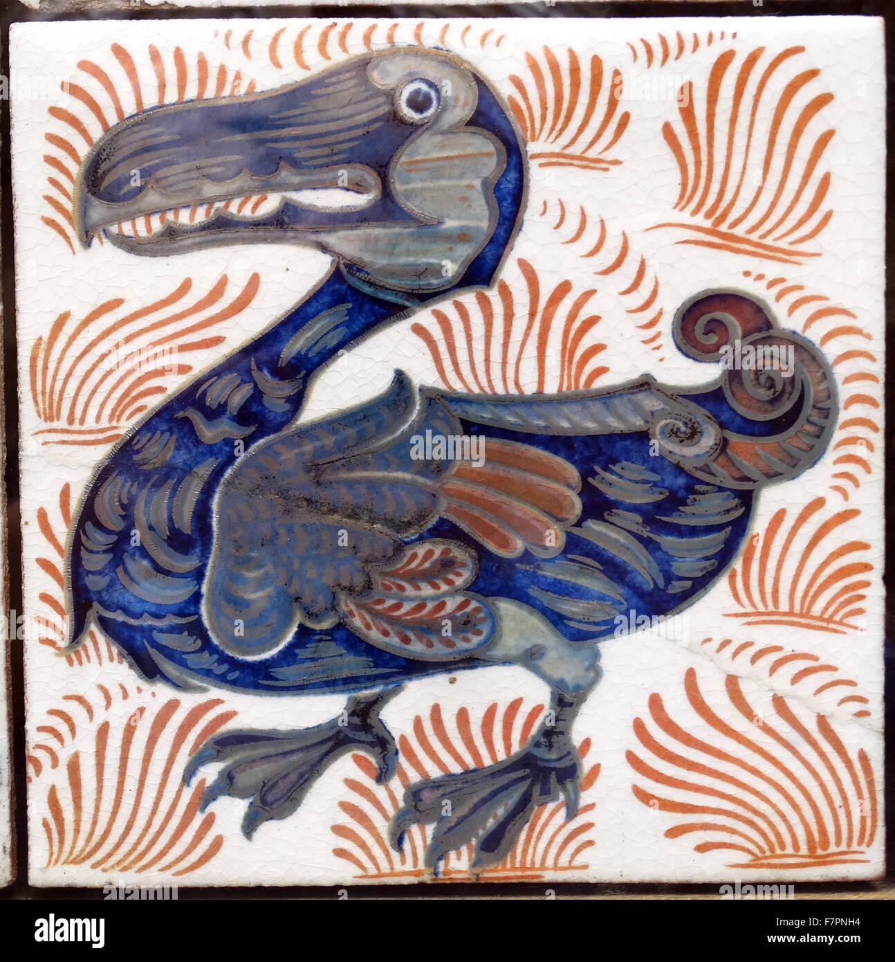 Earthernware tile with dodo pattern , with underglaze blue and lusters on a  white slip. Dated 1882 Stock Photo - Alamy