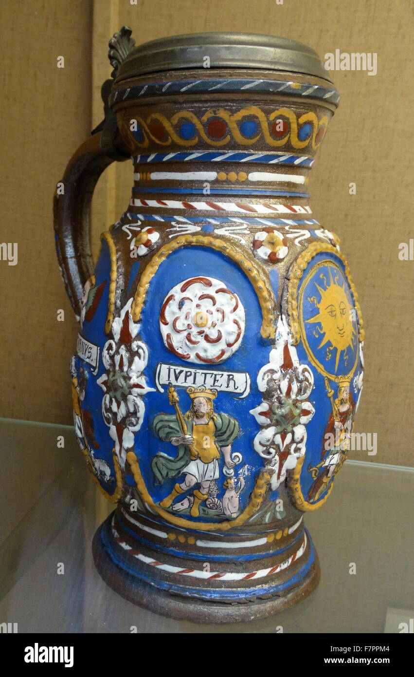 Salt-glazed stoneware Tankard, with moulded decoration and copper gilt mounts. Dated 16th Century Stock Photo