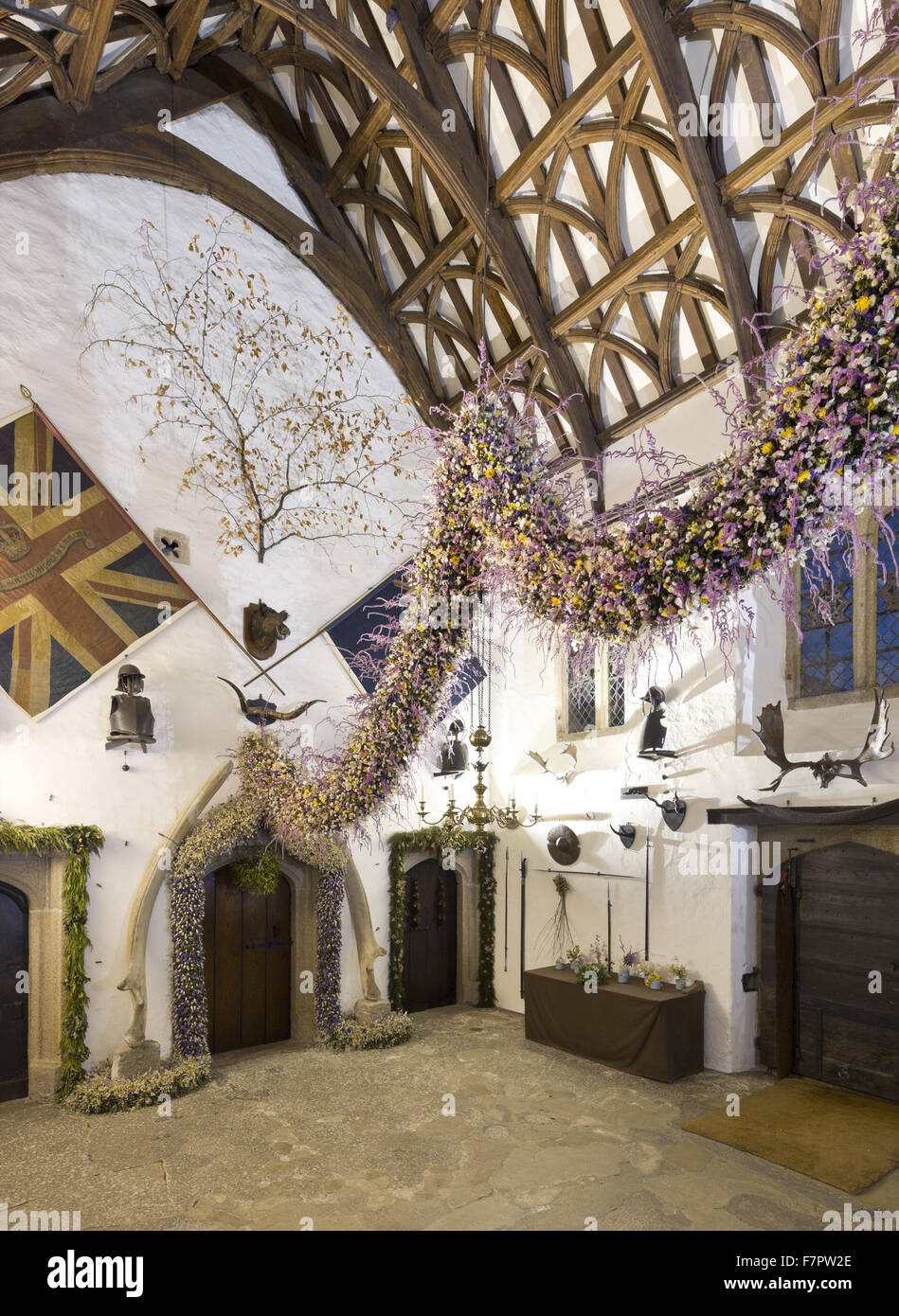 The Christmas Garland in the Tudor Hall at Cotehele, Cornwall. The garland is constructed annually from flowers grown and dried at Cotehele - a tradition which began in the 1950s. 2013 was a bumper year, with approximately 40,000 flowers making up the gar Stock Photo