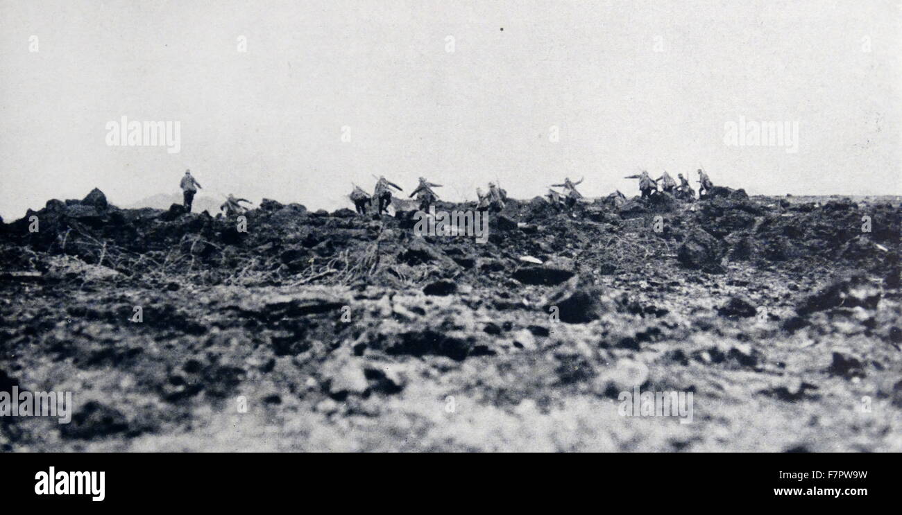World war One: German troops run across a muddy terrain, towards a ...