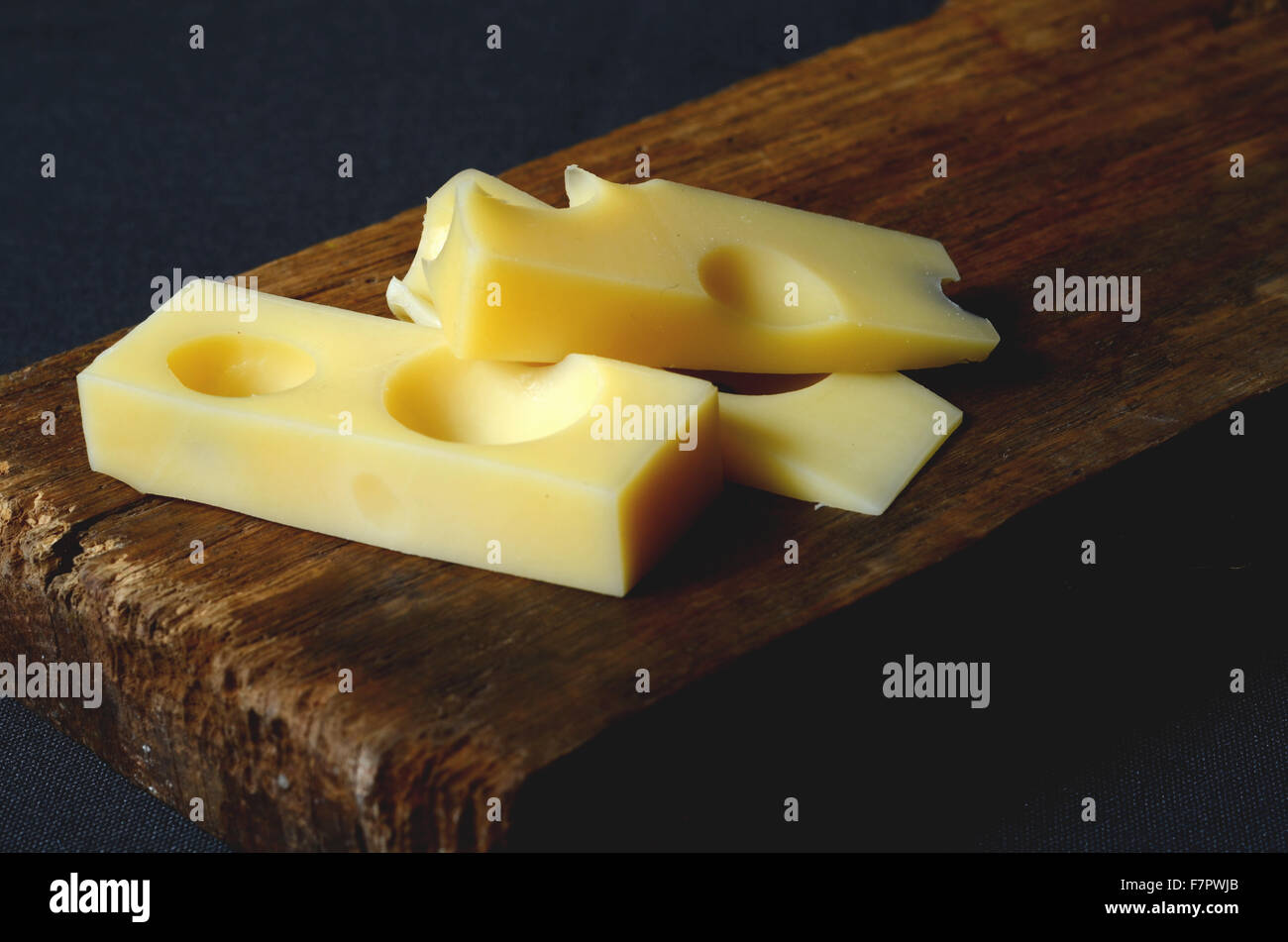 pieces and slices of fresh emmental cheese Stock Photo