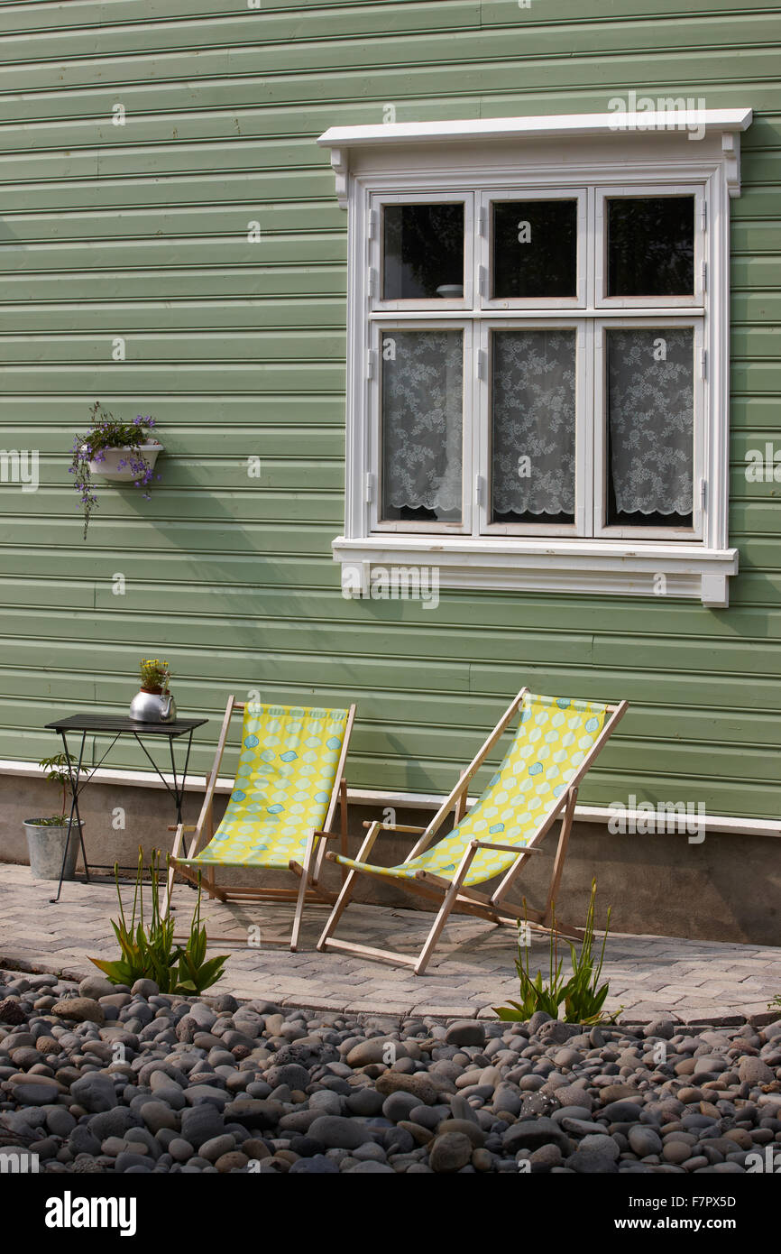 Picture of Traditional wooden icelandic facade with deckchairs in Seydisfjordur ...