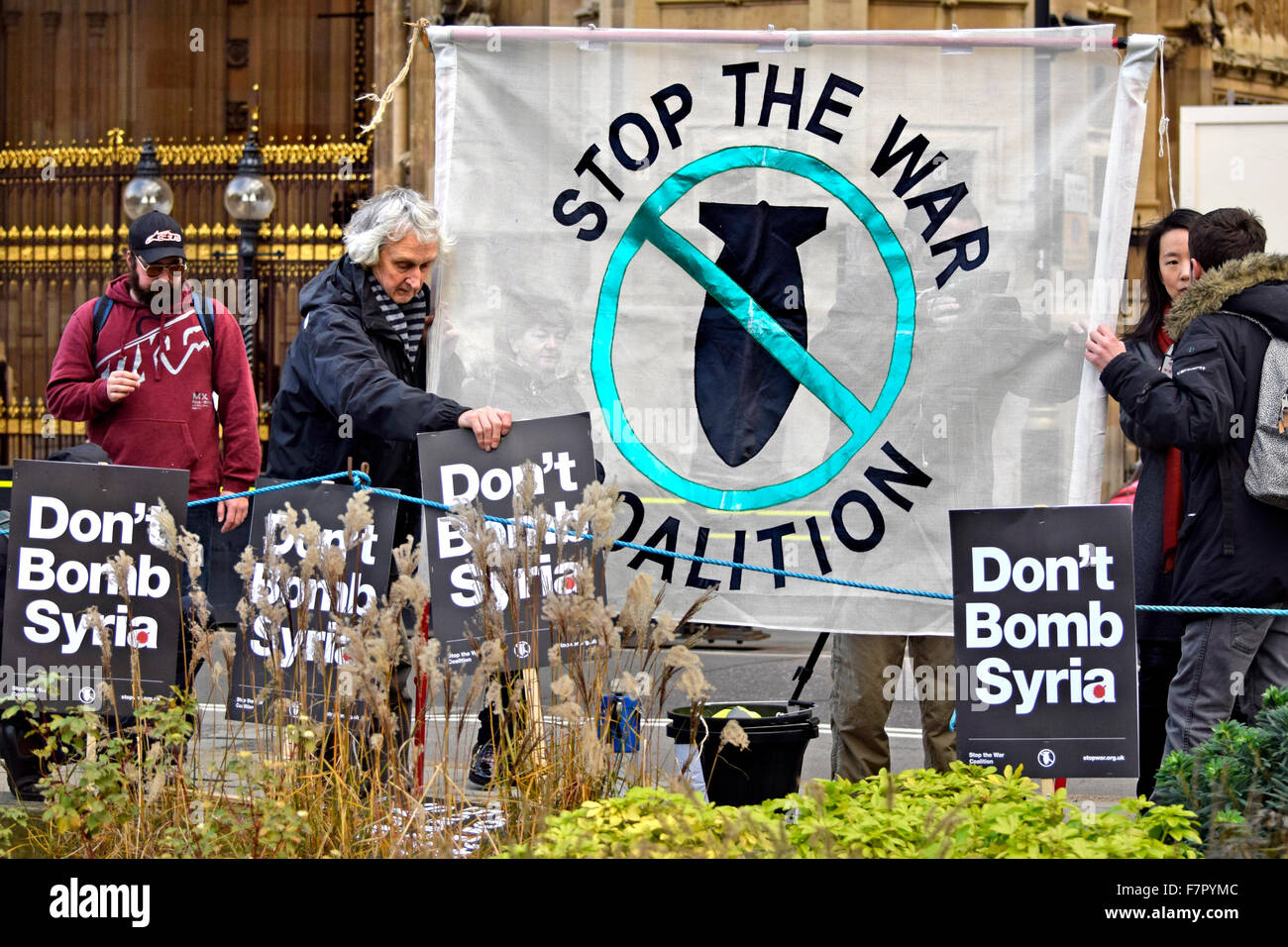 London, UK. 2nd December, 2015. The world's media and a small number of protesters gather on College Green opposite the Houses of Parliament as MPs debate the bombing of ISIS in Syria. Stop The War Coalition Credit:  PjrNews/Alamy Live News Stock Photo