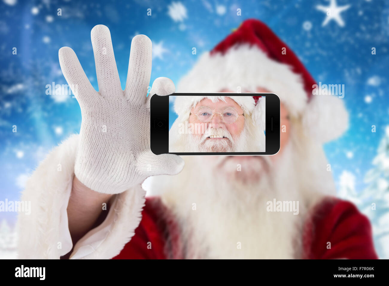 Composite image of hand holding mobile phone Stock Photo