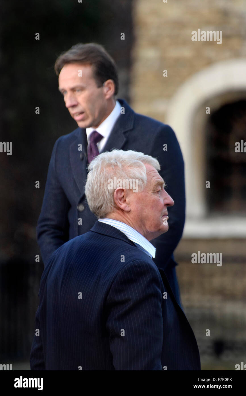 London, UK. 2nd December, 2015. The world's media and a small number of protesters gather on College Green opposite the Houses of Parliament as MPs debate the bombing of ISIS in Syria. Paddy Ashdown waiting to be interviewed for TV by Ben Brown (behind) Credit:  PjrNews/Alamy Live News Stock Photo