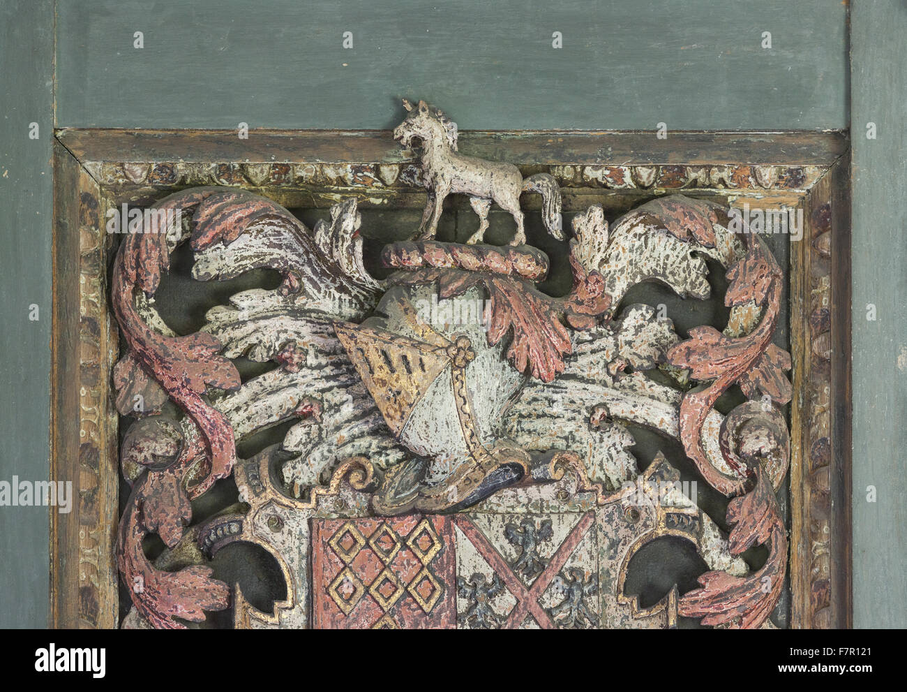 Detail of the elaborate wooden chimneypiece (c.1629) in Henry Ferrer's Bedroom, Baddesley Clinton, Warwickshire. The carving includes the arms of the Ferrers of Groby quartering Hampden (Henry's grandmother's family) and a shield of pretence in the centre Stock Photo