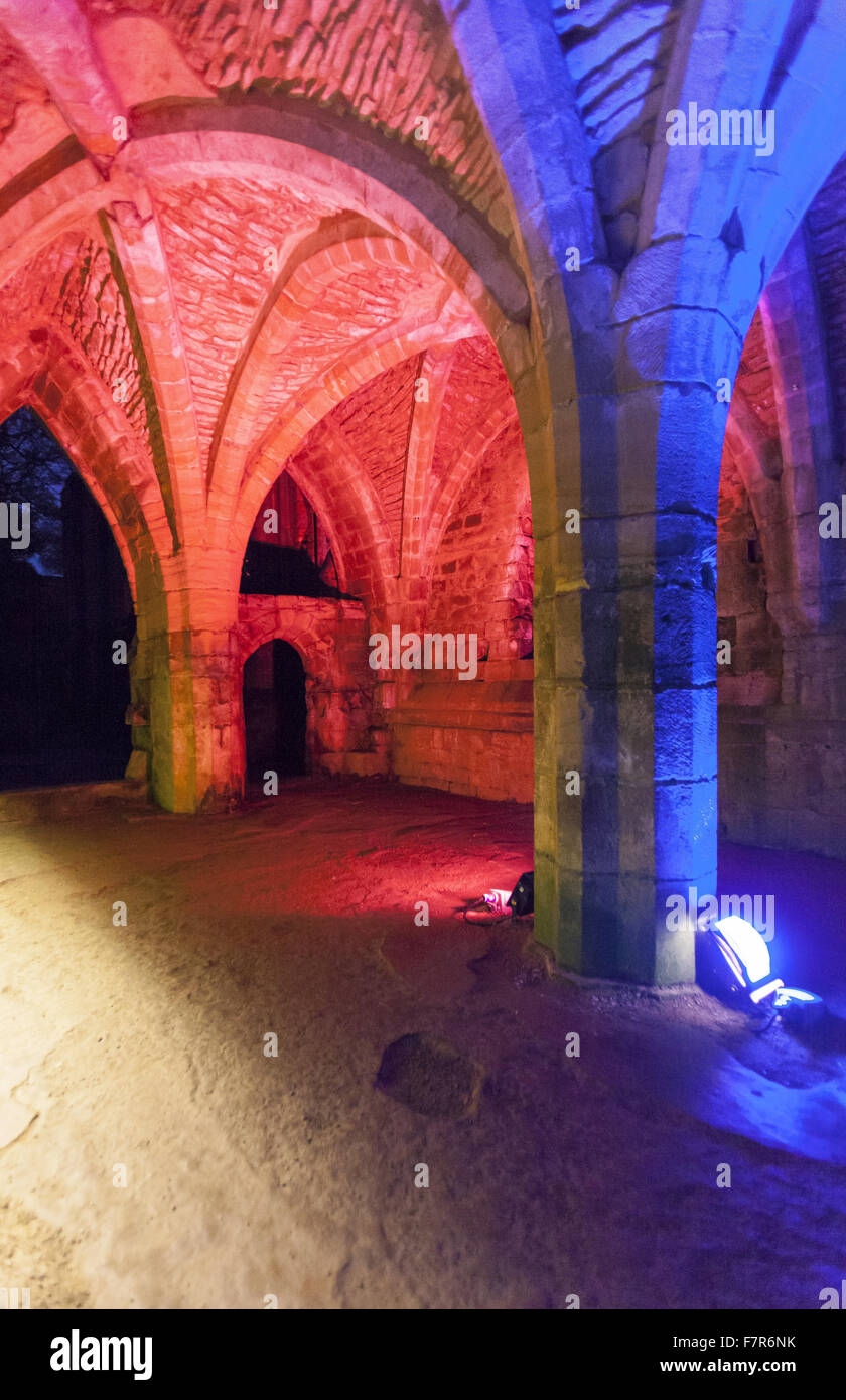 Fountains Abbey lit up with coloured lights at Christmas time, North