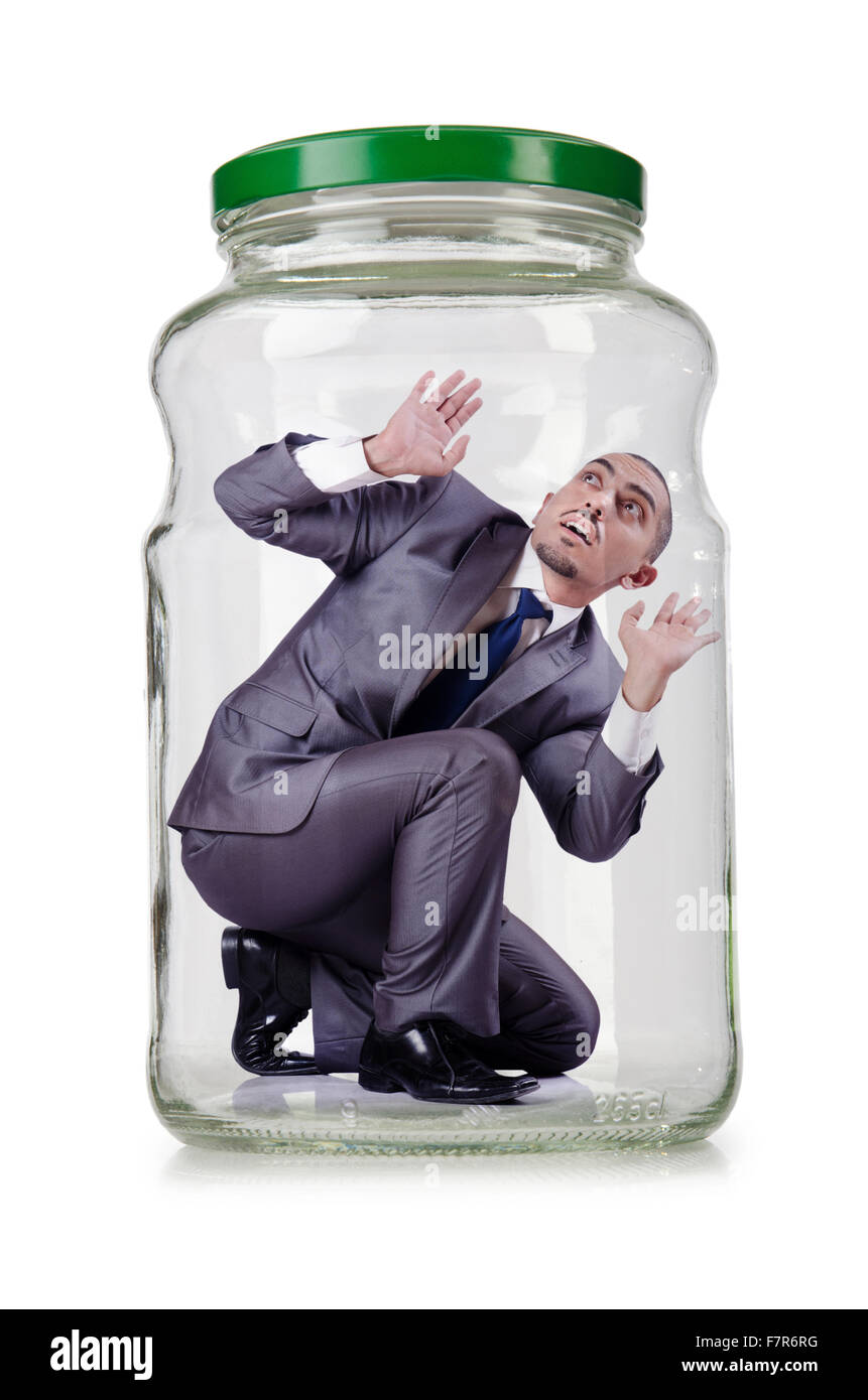 Young businessman in glass jar Stock Photo