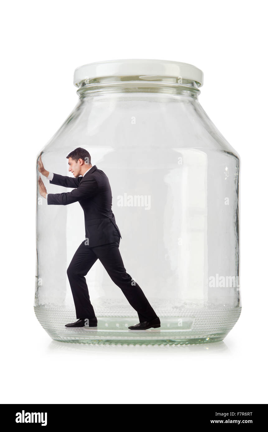 Young businessman in glass jar Stock Photo