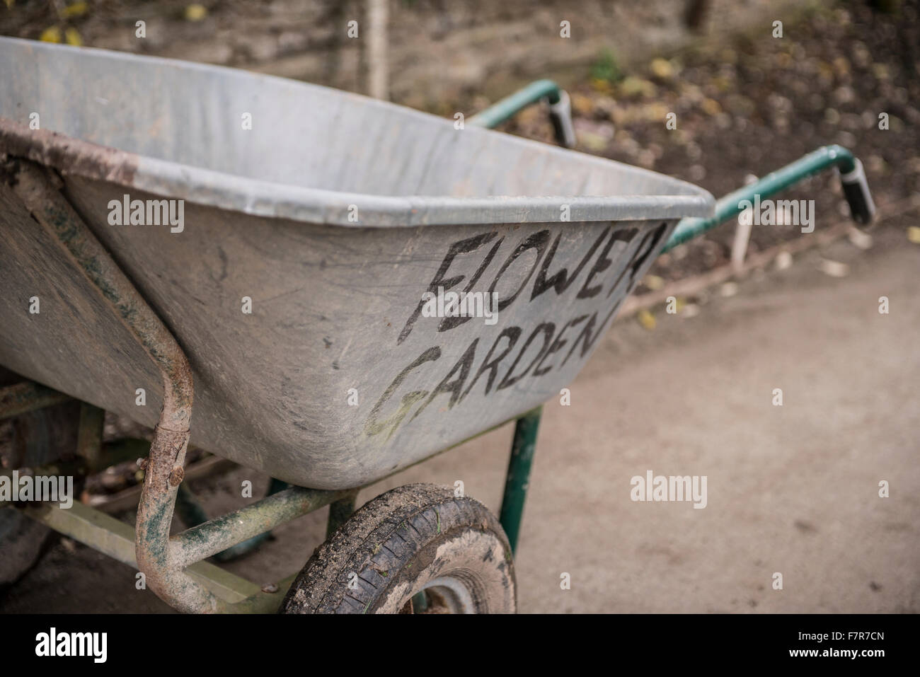 A wheelbarrow labeled for a flower garden Stock Photo Alamy