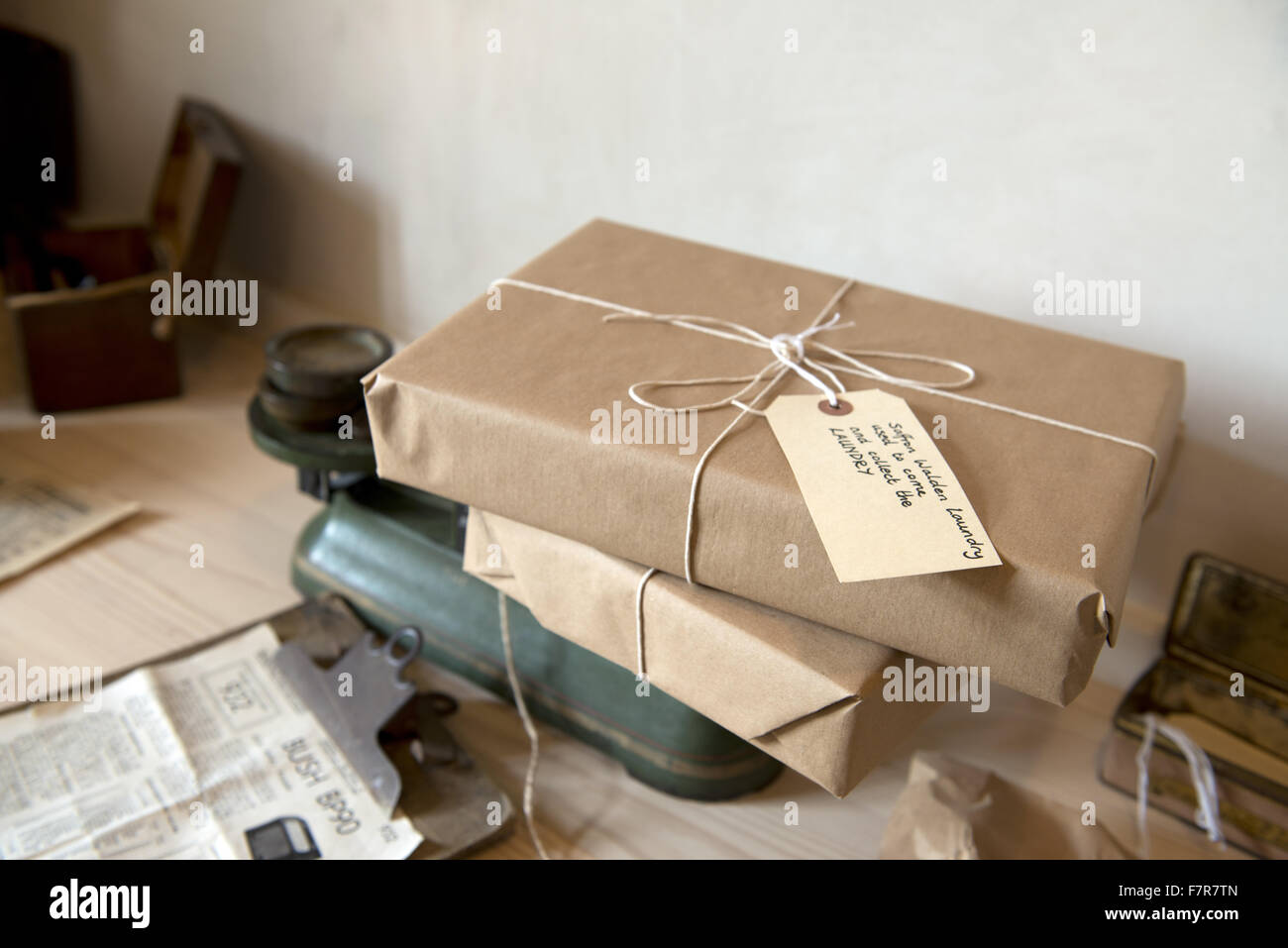 Packages wrapped in brown paper and string at Anglesey Abbey, Gardens and Lode Mill, Cambridgeshire. Stock Photo