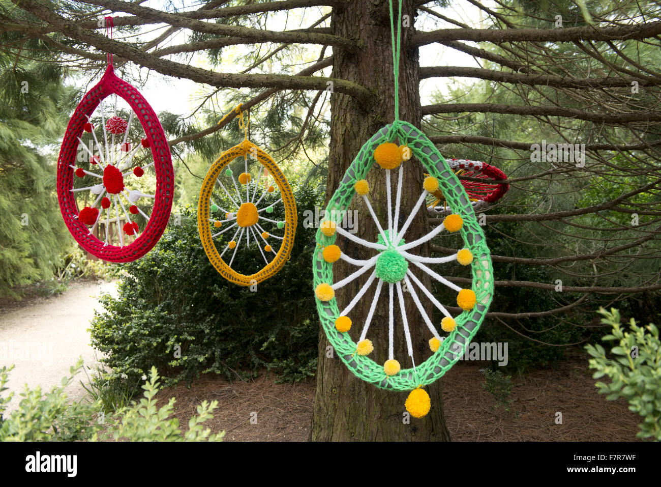 Dreamcatchers hanging from a tree in the garden at Anglesey Abbey, Gardens and Lode Mill, Cambridgeshire. Stock Photo