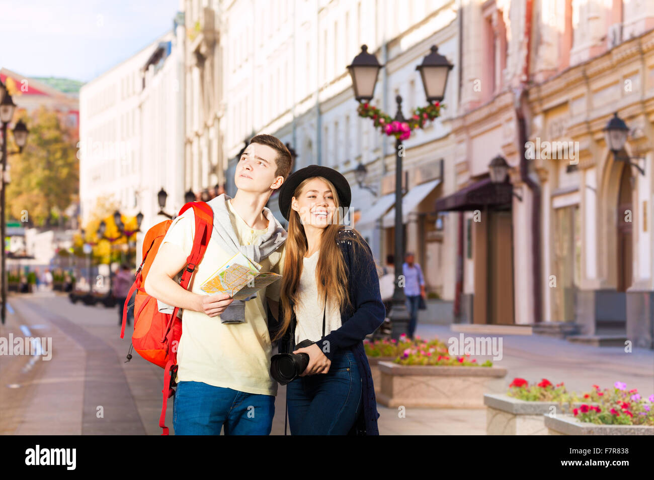 Beautiful woman and man as tourists sightseeing Stock Photo - Alamy
