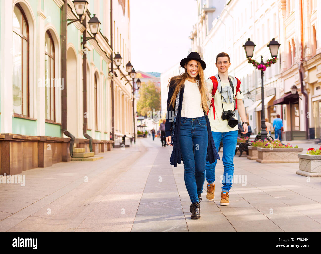Couple holding hands during walking on the street Stock Photo - Alamy