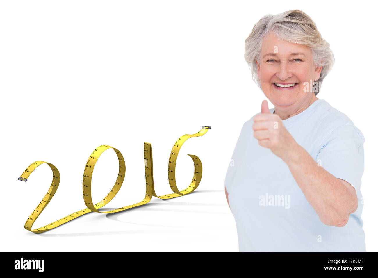 Composite image of senior woman showing thumbs up Stock Photo - Alamy