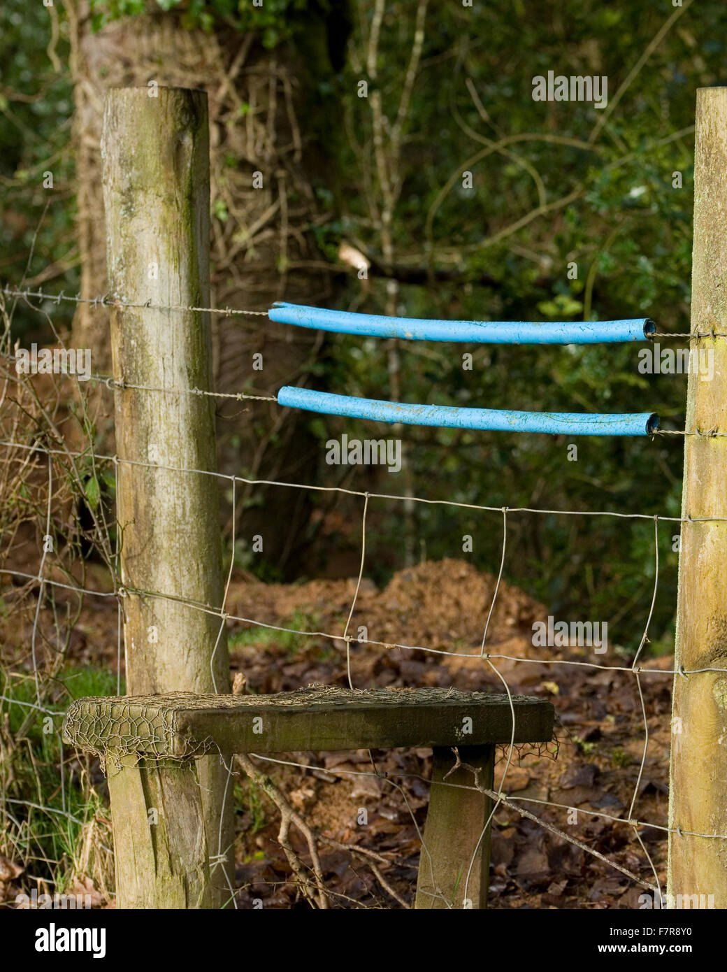 stile crossing barbed wire Stock Photo