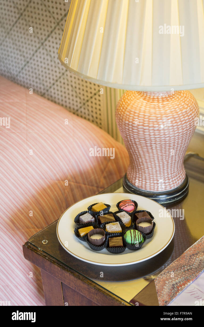 Chocolates beside the bed at Middlethorpe Hall Hotel, Restaurant and Spa, North Yorkshire. Middlethorpe is a William and Mary house, built in 1699, set in manicured gardens and parkland. Stock Photo