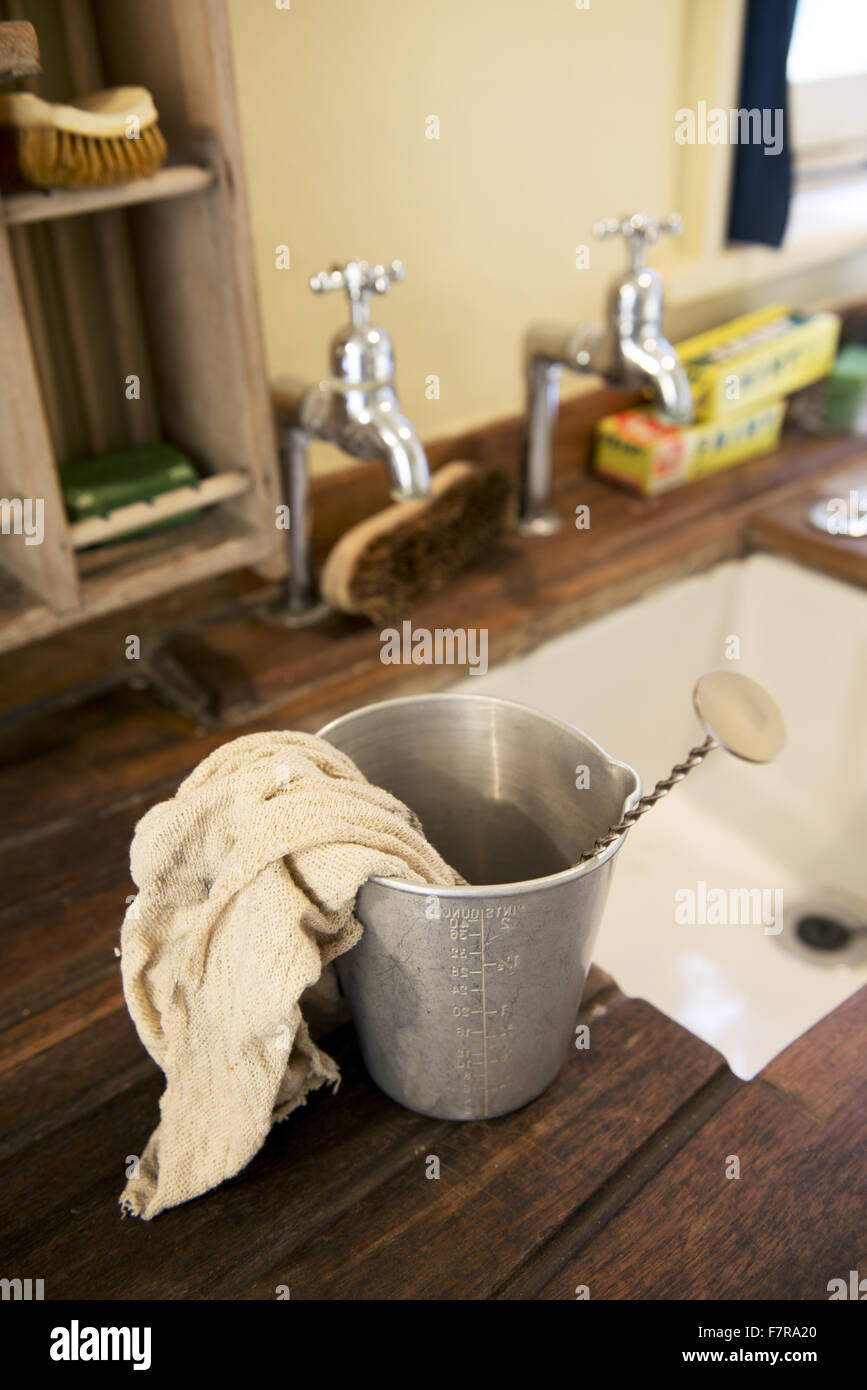 Cleaning items at Anglesey Abbey, Gardens and Lode Mill, Cambridgeshire. Stock Photo