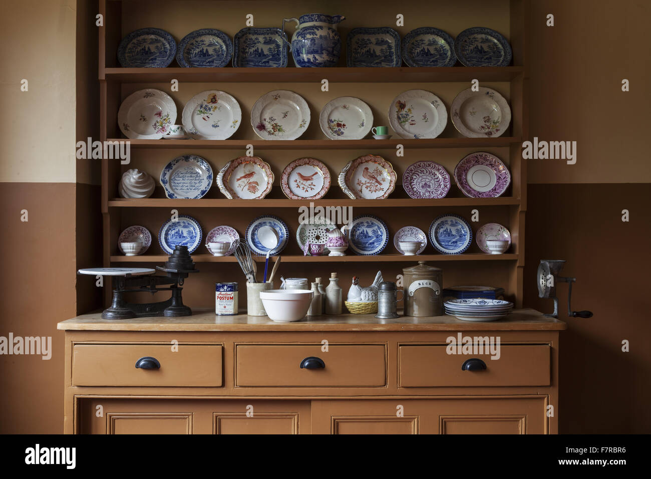 Crockery And Cooking Utensils Displayed On The Kitchen Dresser At