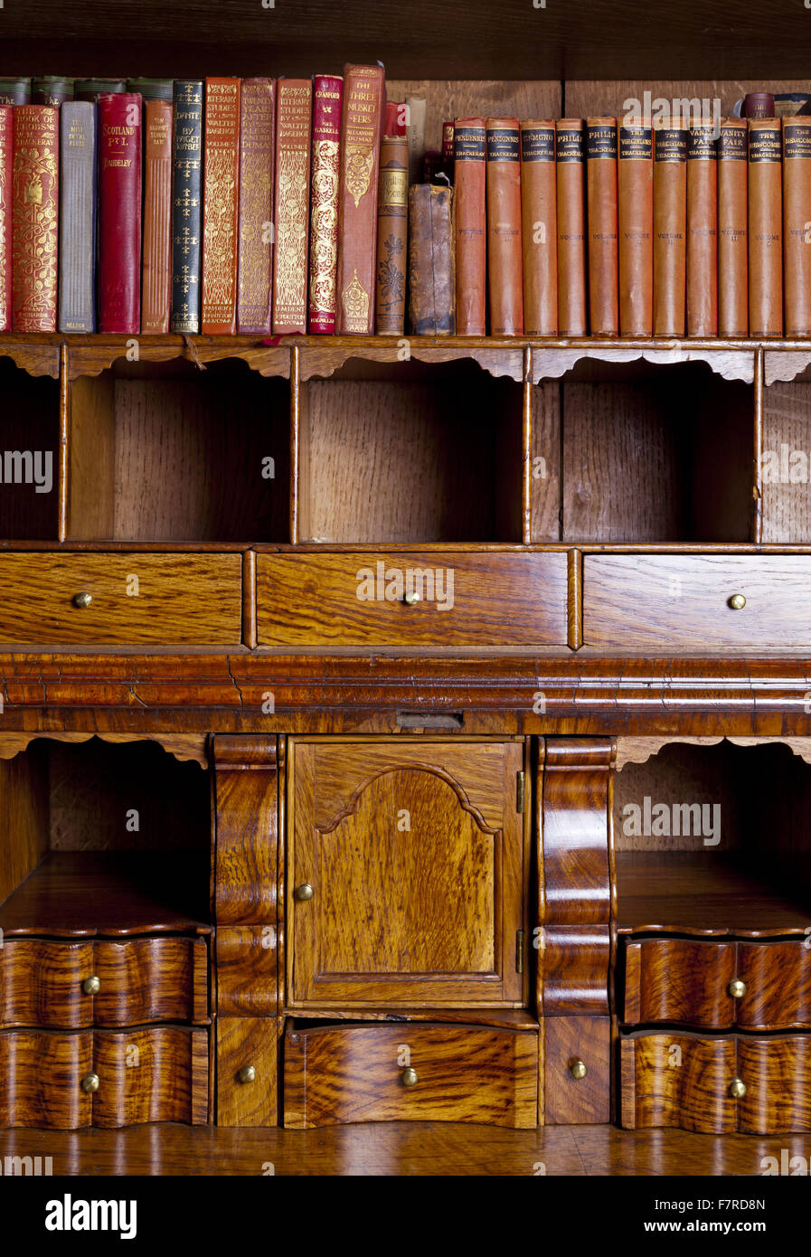 The Pollard oak writing cabinet in the Library at Eyam Hall and Craft Centre, Derbyshire. Eyam Hall is an unspoilt example of a gritstone Jacobean manor house, set within a walled garden. Stock Photo