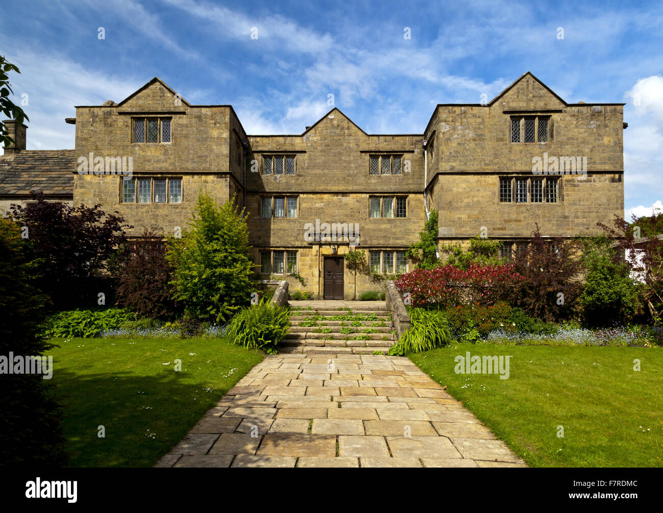 The front of Eyam Hall and Craft Centre, Derbyshire. Eyam Hall is an unspoilt example of a gritstone Jacobean manor house, set within a walled garden. Stock Photo